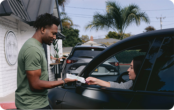 image fo clover helping drive through employee