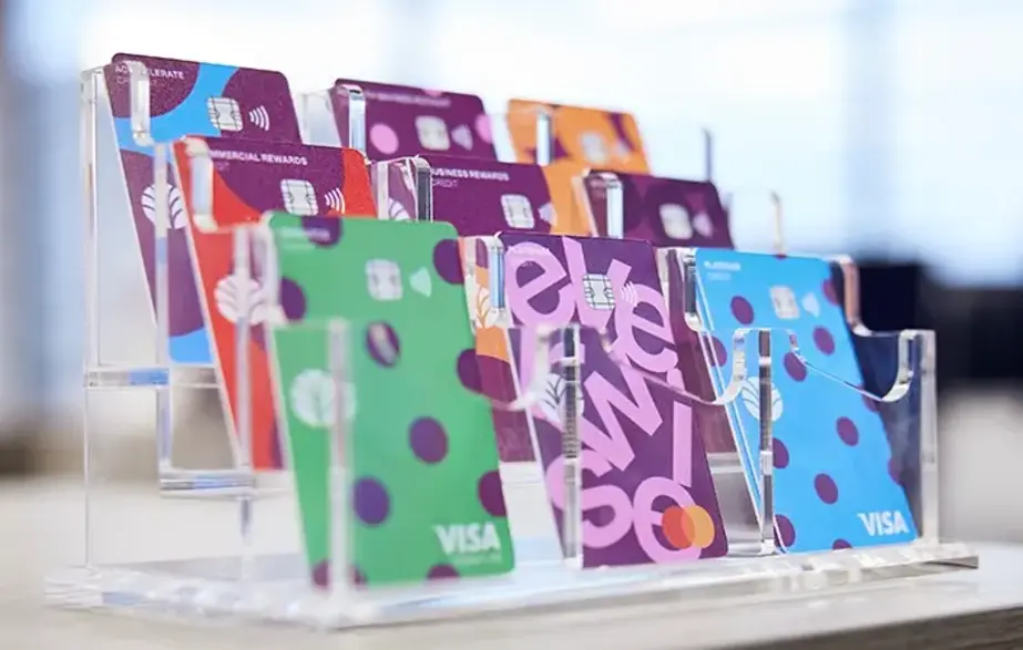 Image of a variety of Everwise credit and debit cards in an acrylic desktop display