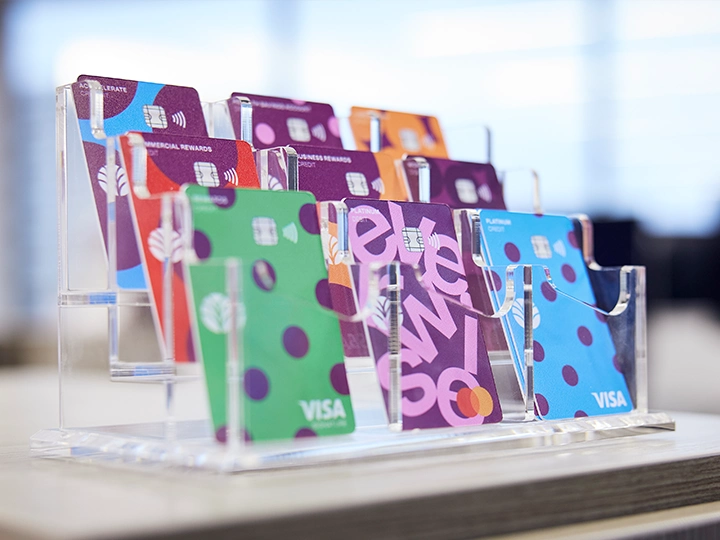Image of a variety of Everwise credit and debit cards in an acrylic desktop display