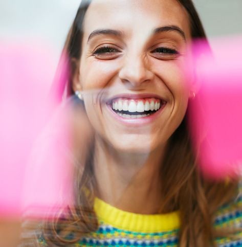 Smiling woman planning with post its