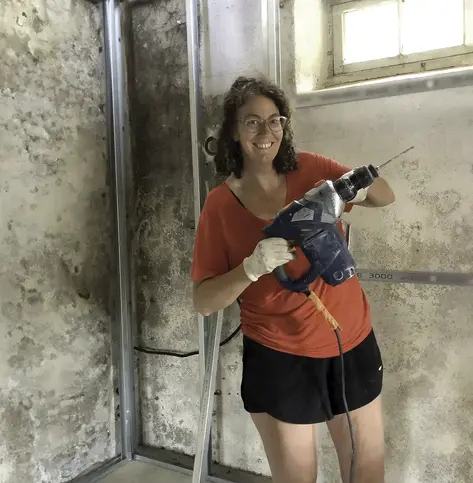 woman with a drill during a home renovation using HELOC funds