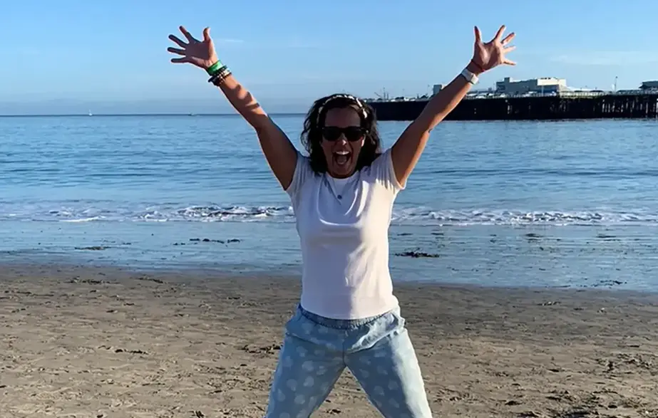 woman excited to build financial wellness habits