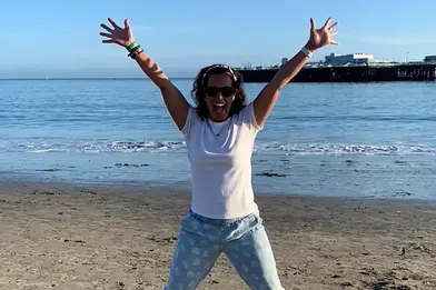 woman excited to build financial wellness habits