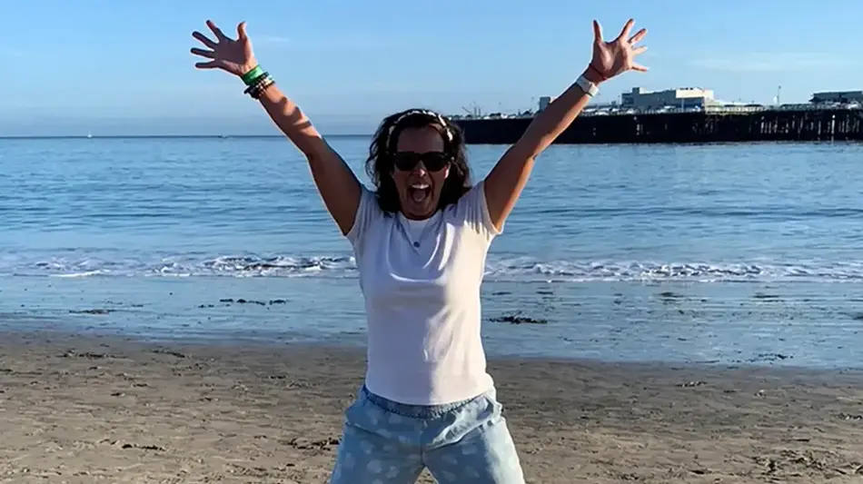 woman excited to build financial wellness habits