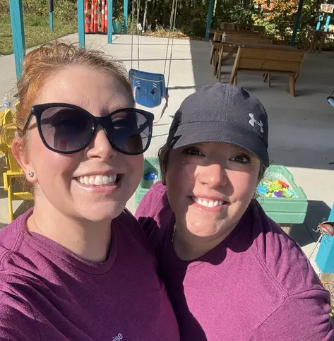 Two Everwise employees smiling. 