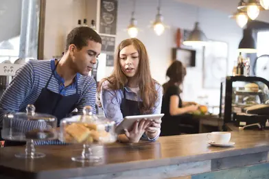 Teens working at cafe counter