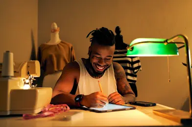 Man working on his ipad at a desk.