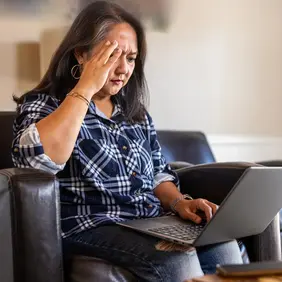 member distressed looking at laptop