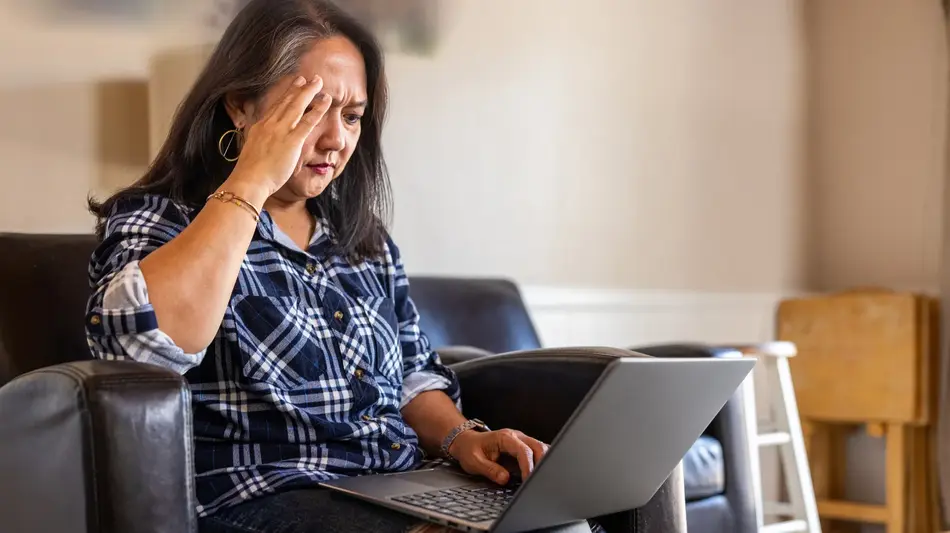 member distressed looking at laptop