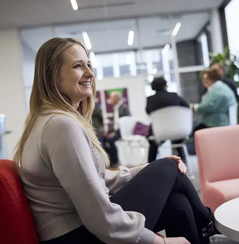 Everwise employee chatting and smiling with someone