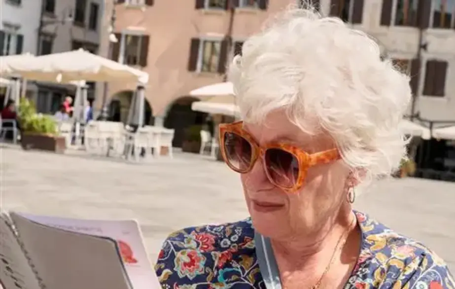 Older woman reviewing a booklet