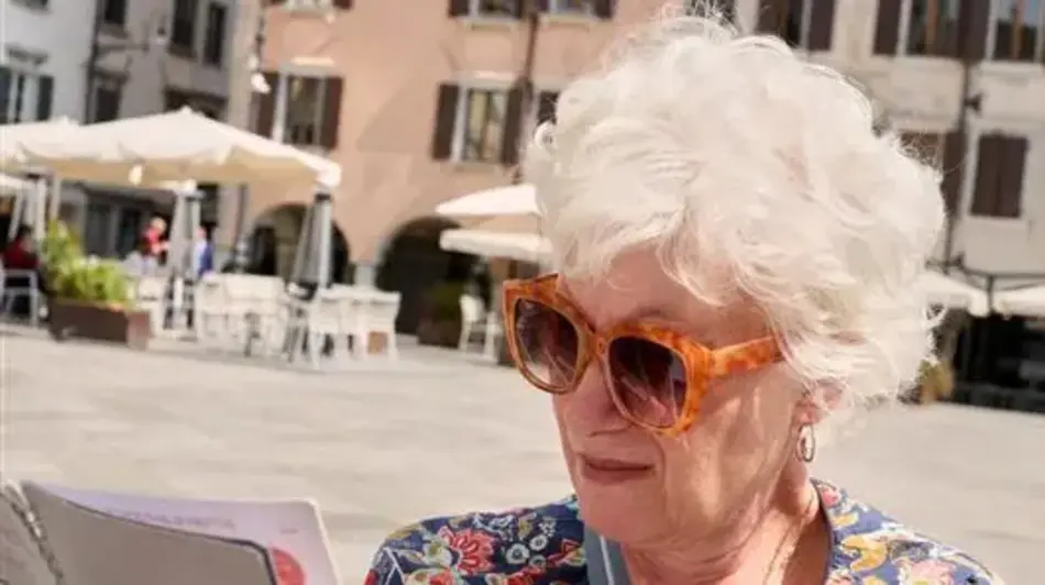 Older woman reviewing a booklet