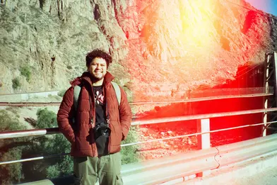 Man standing in front of a mountain.