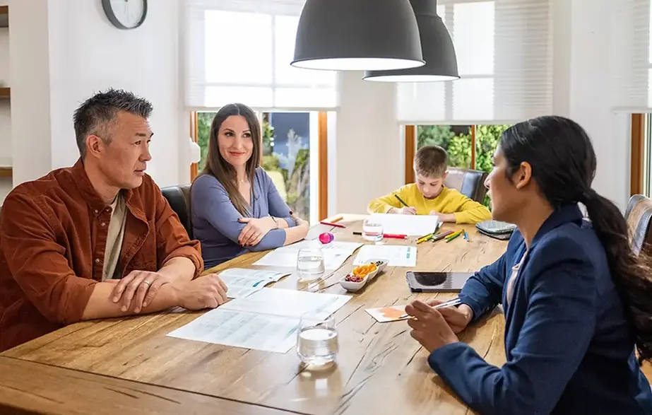 family at a table planning a budget