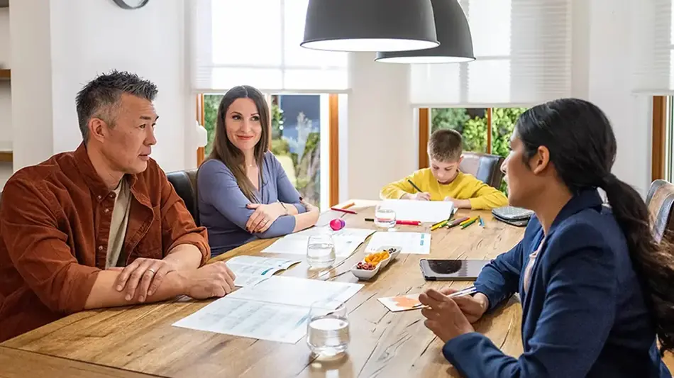 family at a table planning a budget