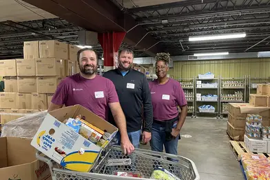 Everwise employees stop for a quick photo while volunteering at the Food Bank of Northern Indiana during the 2025 Everwise Day of Giving event